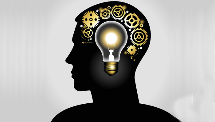 silhouette of a man's head with a glowing light bulb, and gears. the concept of making big idea. File is saved in AI10 EPS